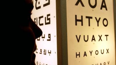 A person taking an eyesight test