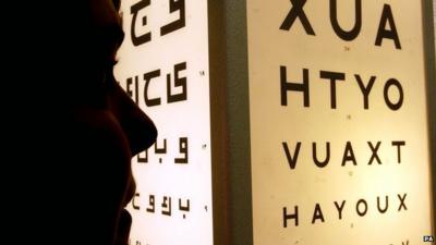 A person taking an eyesight test