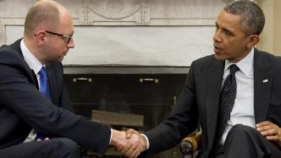 US President Barack Obama shakes hands with Ukrainian Prime Minister Arseniy Yatsenyuk during meetings in the Oval Office of the White House