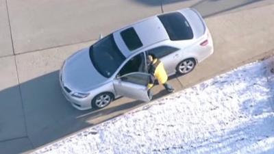 A man stealing a car