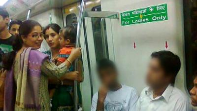 Men sitting on women only seats on Delhi metro