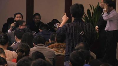 A relative of one of the Chinese passengers on board Malaysia Flight MH370 shows his frustration at a press conference by Malaysia Airlines