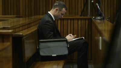 Oscar Pistorius listening to testimony in court in Pretoria