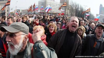 Pro-Russian activists shout slogans during a demonstration rally in the eastern Ukrainian city of Donetsk on March 15, 2014