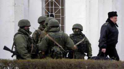 Ukrainian officer leaves base at Novoozerne after it was seized