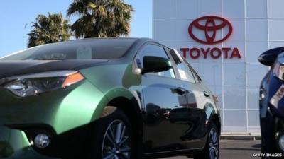 Toyota logo and cars