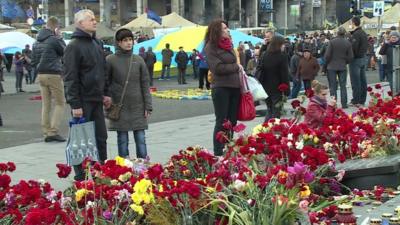 People near flowers