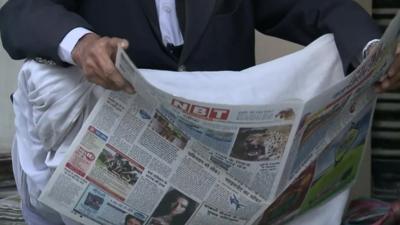 Man reading newspaper