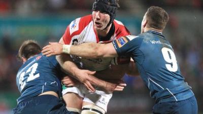 Scarlets pair John Lewis and Gareth Davies tackle Stephen Ferris