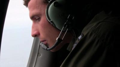 Man looking out of plane window