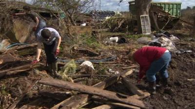 Young farmers help clear up flood damage