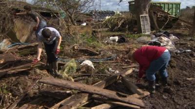 Young farmers help clear up flood damage