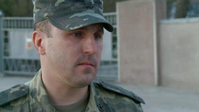 A member of the military at the Ukrainian air base in Evpatoria