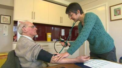 Doctor listens to patient's heart
