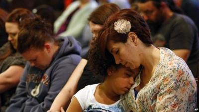 Arlington residents pray in the town's church