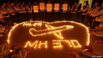 Students pray for missing plane passengers