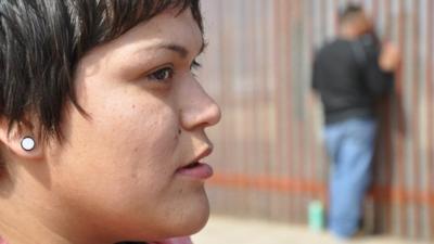 Stephany Ramirez at the border fence in Tijuana.