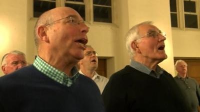 Choir members singing