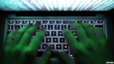 Man typing on a computer