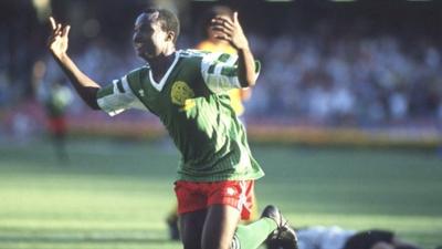 Roger Milla celebrates after scoring for Cameroon against Colombia