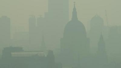 St. Paul's Cathedral is seen among the skyline through the smog in central London on April 22, 2011
