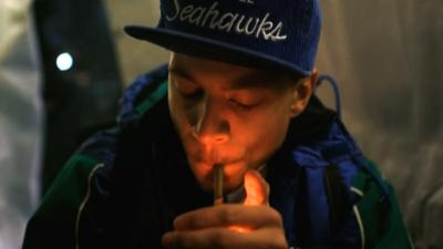 Man smokes a joint a pro-marijuana gathering in Seattle, Washington