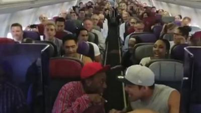 Cast members sing Circle of Life on plane