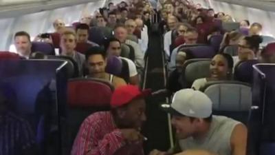 Cast members sing Circle of Life on plane