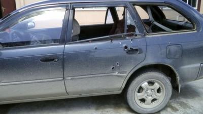 Bullet holes in the car in which the journalists were travelling