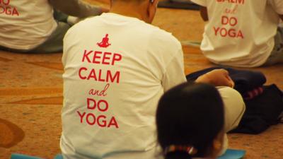 NRI conference in London, with a t-shirt saying "keep calm and do yoga".