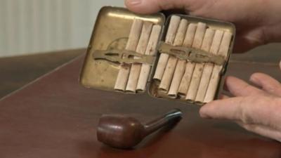 Soldier's half-smoked pipe and 10 hand-rolled cigarettes