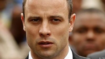 Olympic and Paralympic track star Oscar Pistorius arrives ahead of his trial at the North Gauteng High Court in Pretoria 9 April 2014