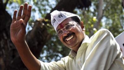 Leader of the AAP, Arvind Kejriwal waves to supporters