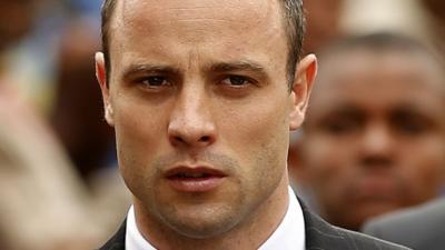 Oscar Pistorius arrives at court in Pretoria on 9 April 2014