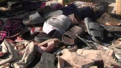 Shoes on rubble of bomb attack in Pakistan