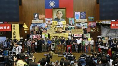 Protesters and banners inside parliament