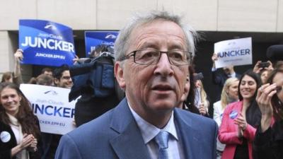Jean-Claude Juncker, Luxembourg's former prime minister, talks to the media before boarding a campaign bus in Brussels, 8 April