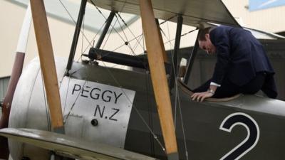 Prince William climbs into the plane