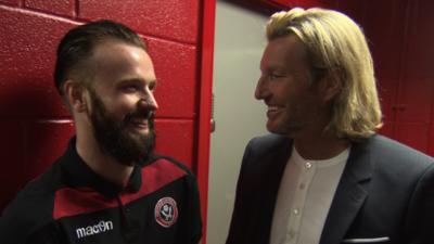 Robbie Savage speaks to Sheffield United's John Brayford