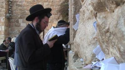 Jewish man in prayer at the Western Wall