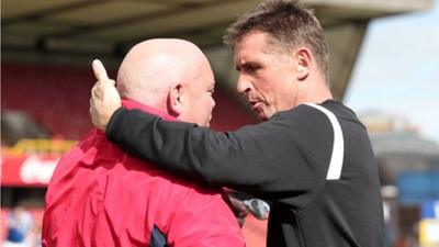 Linfield manager David Jeffrey and Stephen Baxter of Crusaders