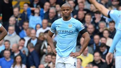 Manchester City's Vincent Kompany looks dejected after his error gifts Liverpool their winning goal