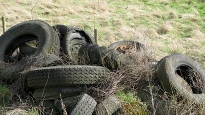 Tyres dumped in a farmer's field