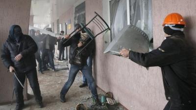 Pro-Russian men storm a police station in the eastern Ukrainian town of Horlivka