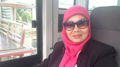 Dahlia, 40, drives the TransJakarta busway, Jakarta's bus system