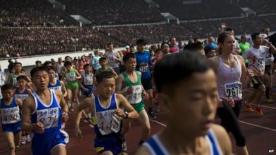 Runners take off inside Kim Il Sung Stadium