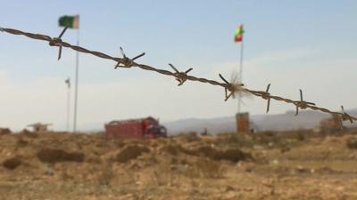 Barbed wire and flags