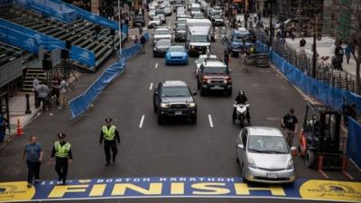 Police officers patrol the finish line of the Boston Marathon, on April 14, 2014 in Boston