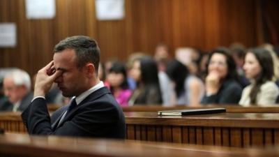 Oscar Pistorius rubs his eye in court in Pretoria, South Africa, Tuesday, April 15, 2014