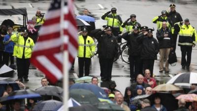 Flag raised at Boston Marathon bombing memorial